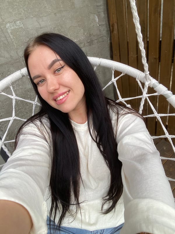Woman takes selfie in hammock chair in Foki, Russia