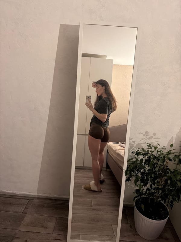 Woman takes mirror selfies in Perm bedroom