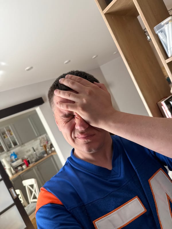 Man photographed with hand to forehead in Vladivostok