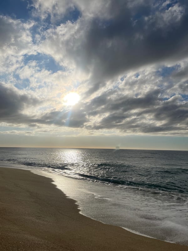 Man enjoys early morning moment at Canet de Mar beach
