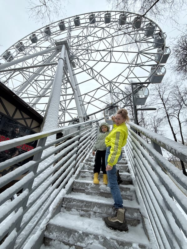 Family visits snowy amusement park in Perm, Russia