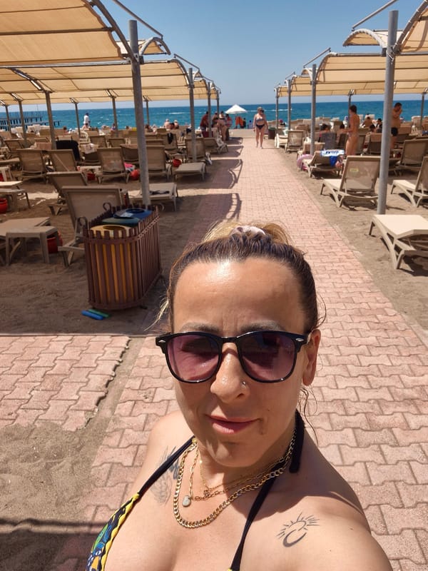 Sunny beach resort day with selfies, flora, and crowds