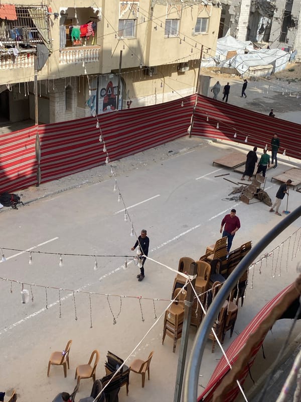 Community gathering documented in Khan Yunis street scene