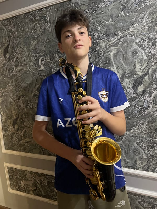 Saxophone and collectibles arranged in a Masazir interior