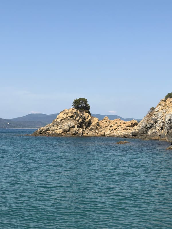 Boating along the rocky Punta Ala coastline, Tuscany