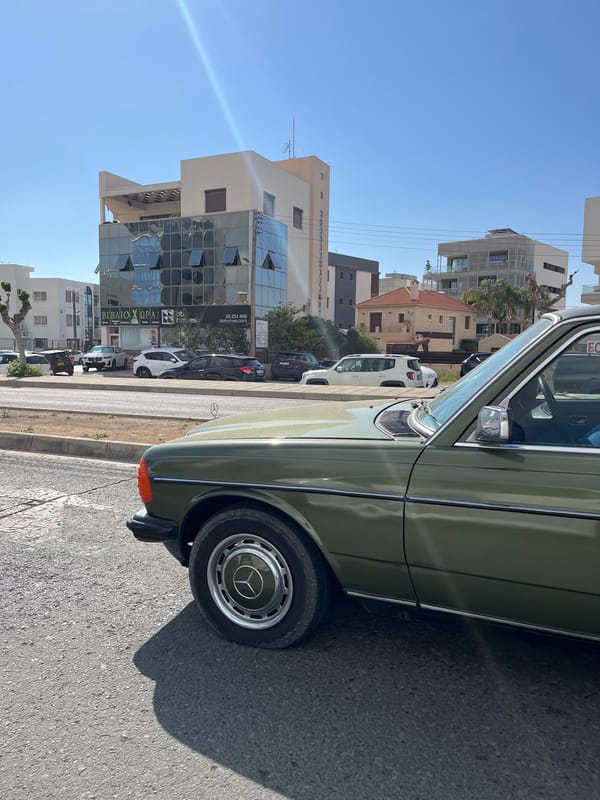 Green Mercedes W123 spotted parked on Limassol street