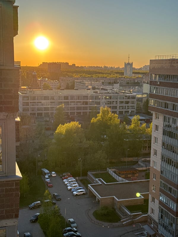 Urban sunset captured from elevated position showing varied cityscape