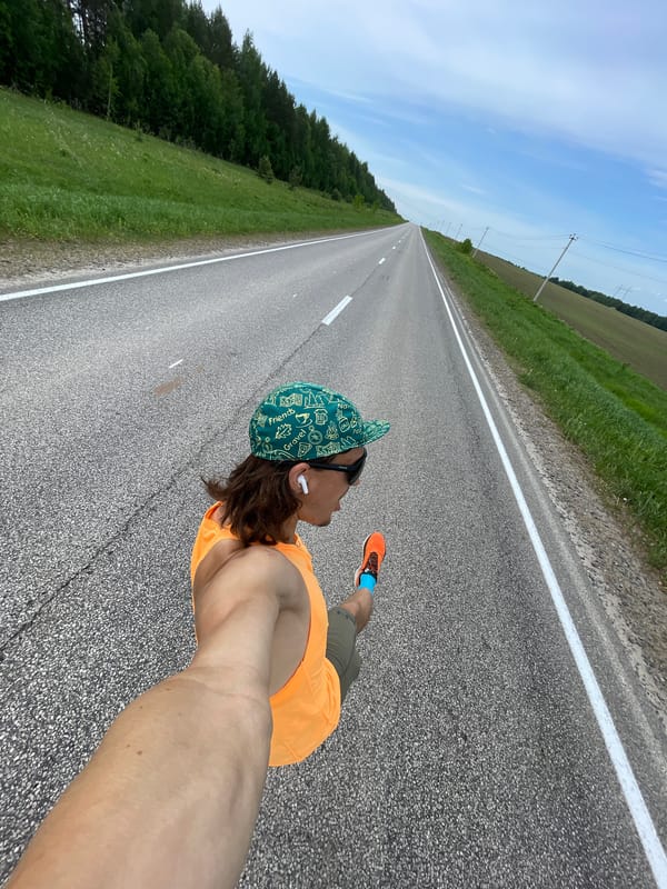Handcycle race documented on rural road in Перевозное, Russia