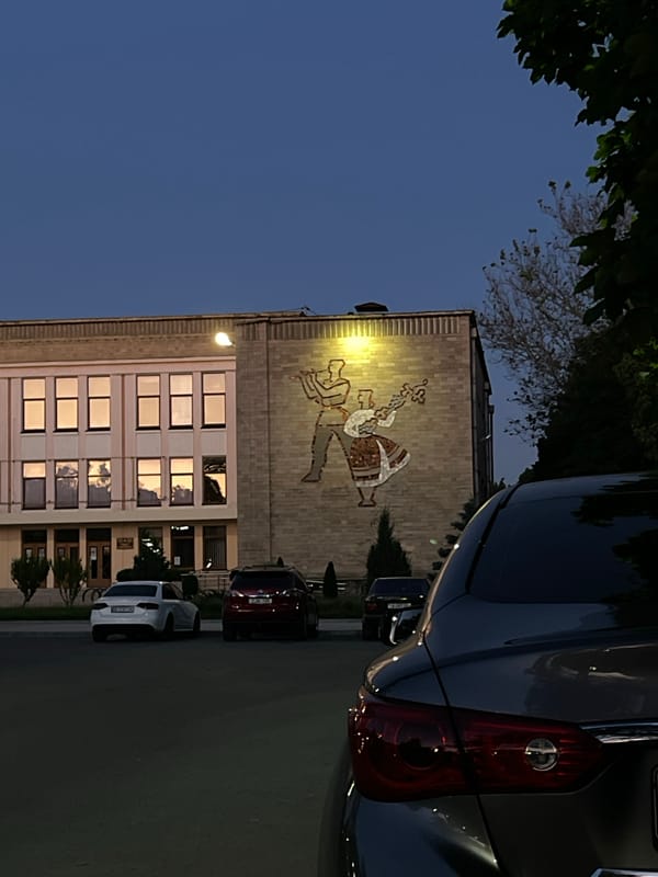 Folk art mural adorns building facade in Bender, Moldova