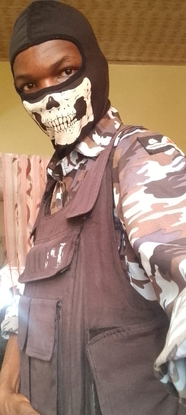 Masked individual in tactical gear observed at undisclosed location