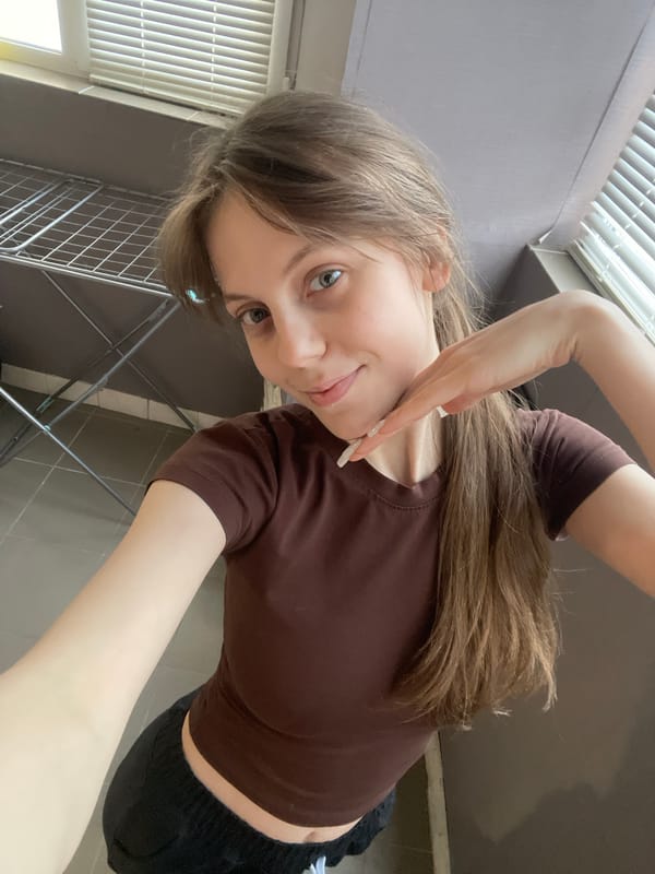 Woman takes selfies during casual afternoon in Ufa