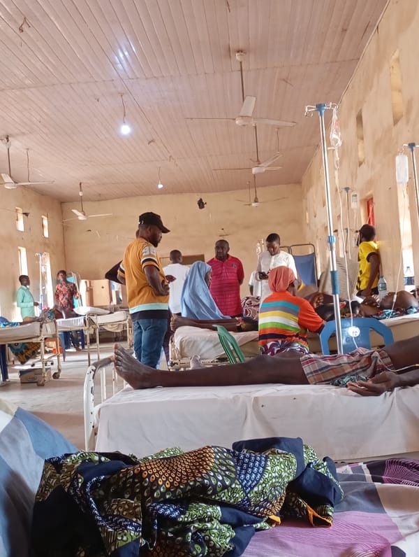 Hospital ward with occupied beds and IV patients documented