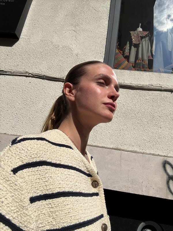 Woman enjoys sunny moment outdoors in Tbilisi
