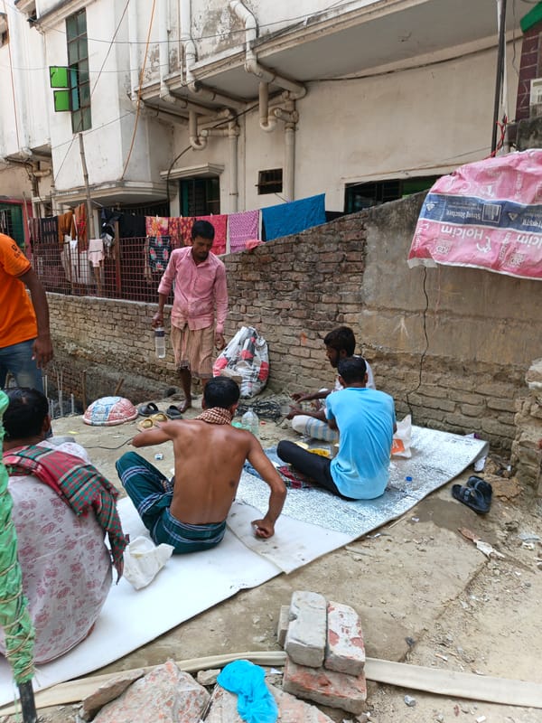 Construction workers take break at Dhaka building site