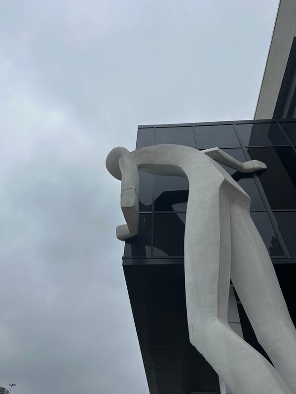 Human sculpture observed on modern building facade in Nizhny Novgorod