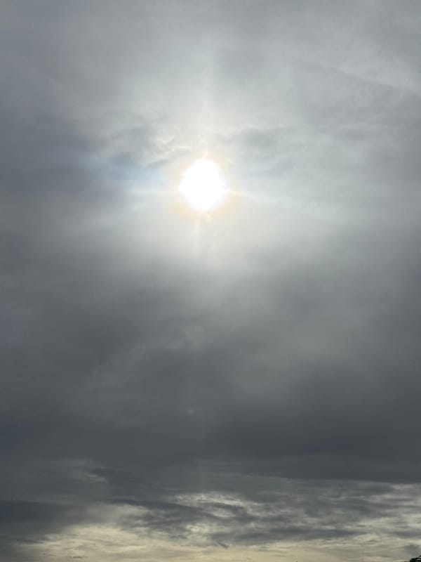Solar halos and dramatic cloud light on an overcast morning