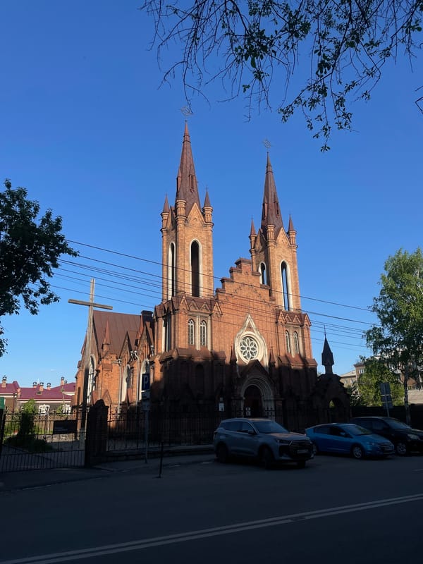 Neo-Gothic church photographed under clear skies in Krasnoyarsk
