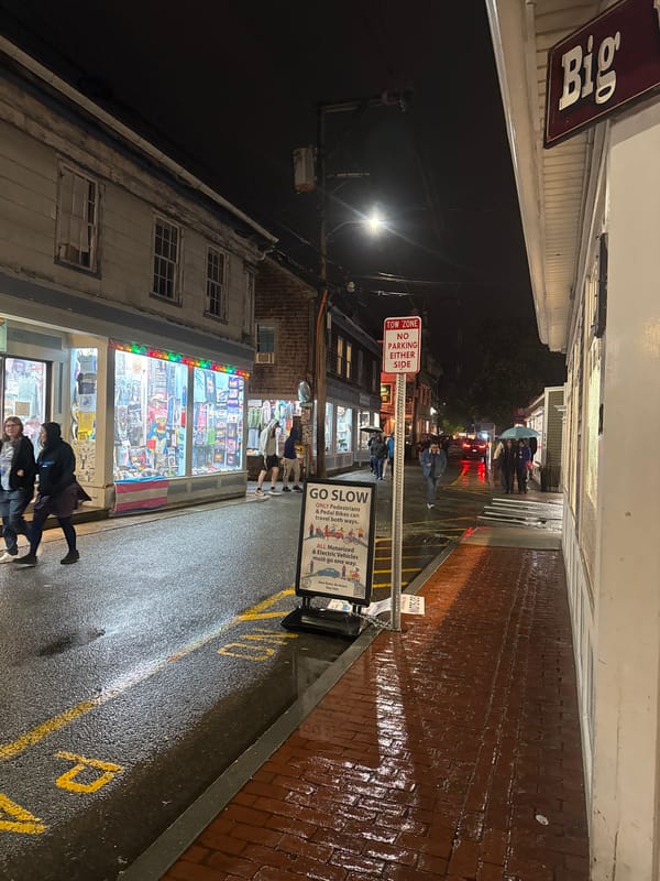 Rainy night scene captured on Provincetown's wet brick streets