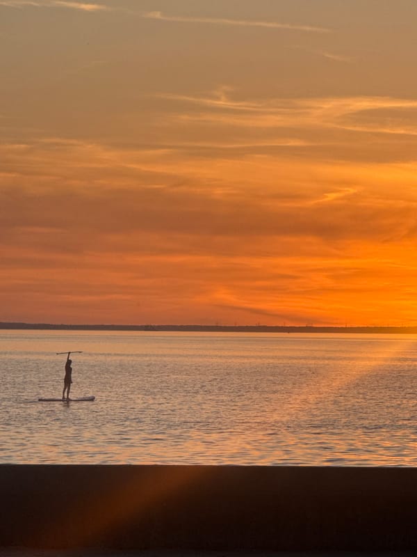 Sunset paddleboarding captured at Lee-on-the-Solent waters