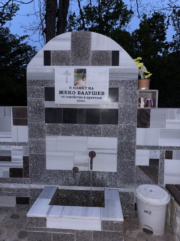 Memorial visit documented in Alamovtsi cemetery at dusk