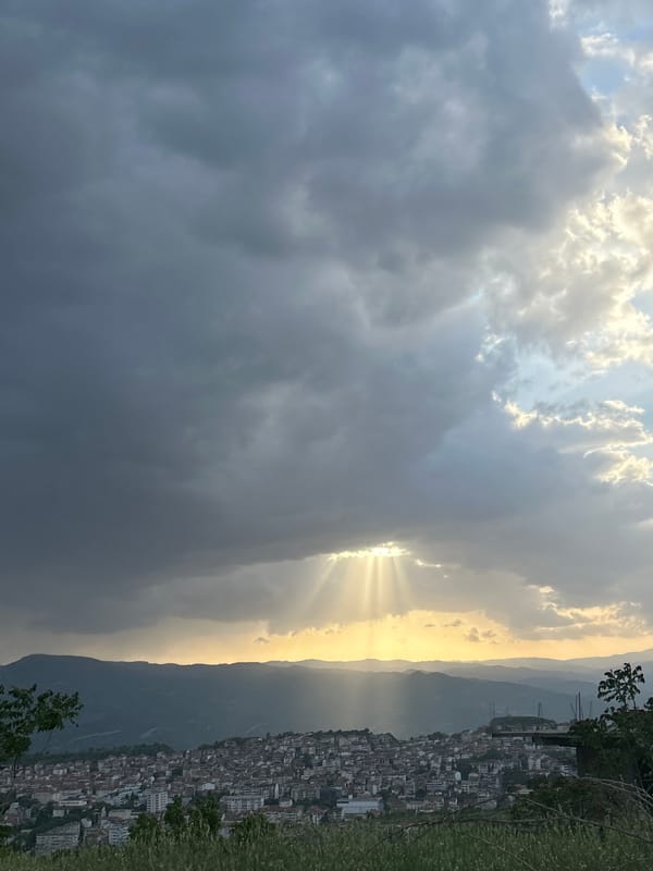 Storm clouds gather over Polenitsa, Bulgaria hillside city