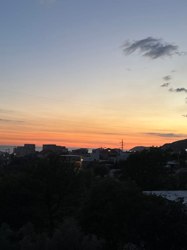Sunset observed over Sustaš, Montenegro with electricity pylon silhouette
