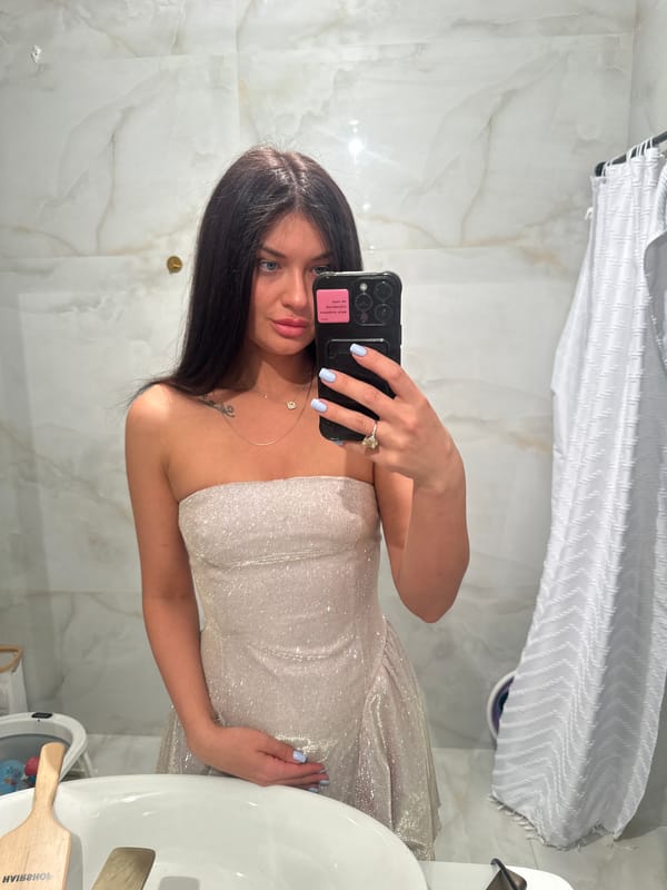 Woman takes rotated mirror selfie in Krasnogorsk bathroom