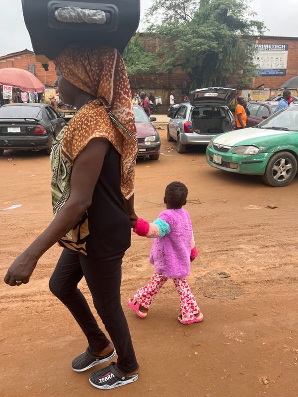 Daily life documented at busy Abuja marketplace during morning hours