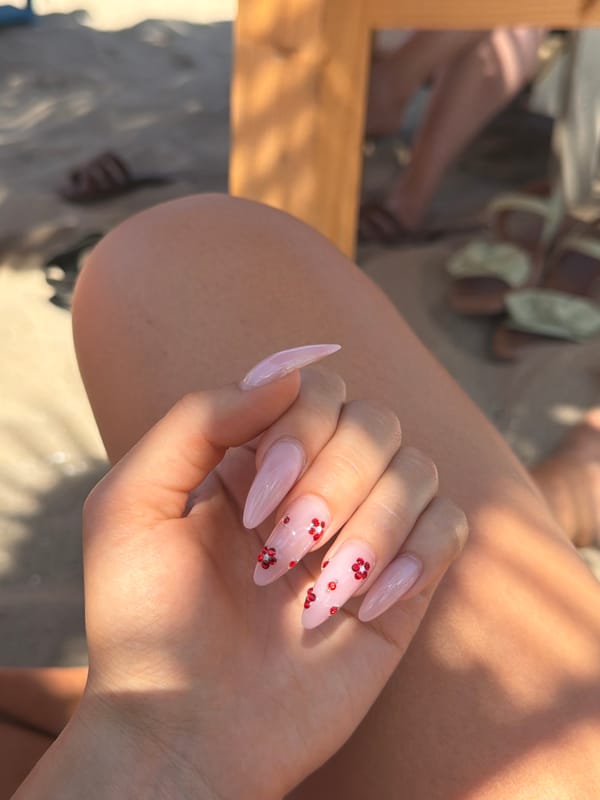 Sunny beach day in Varna with nail art and thatched umbrellas