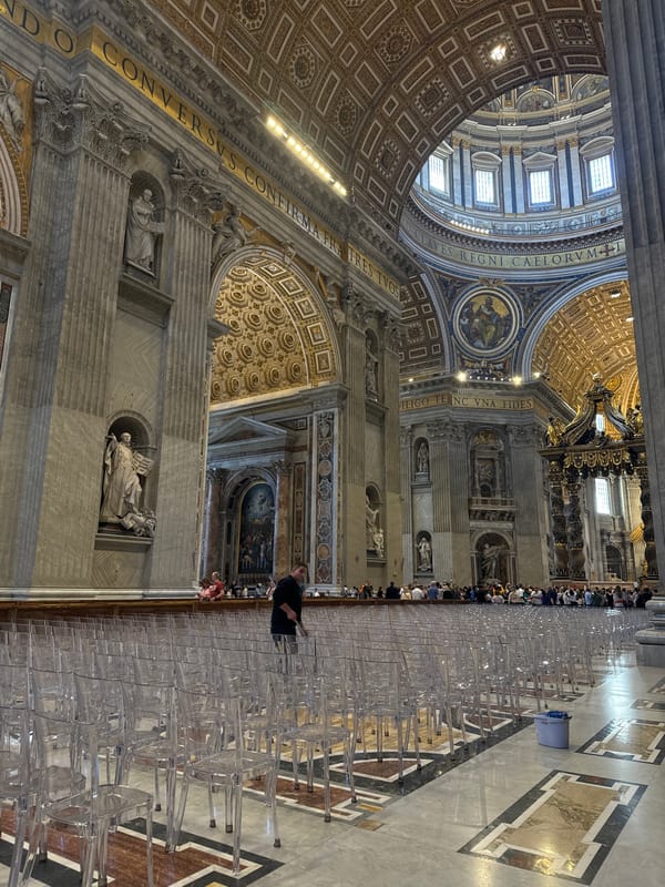 Visitors in green gather at St. Peter's Basilica