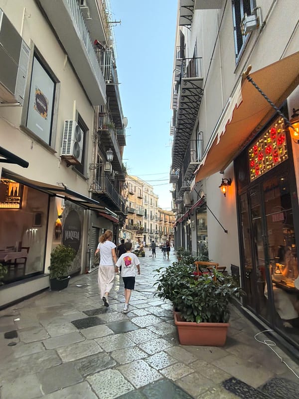 Late afternoon street scene on Palermo cobblestones