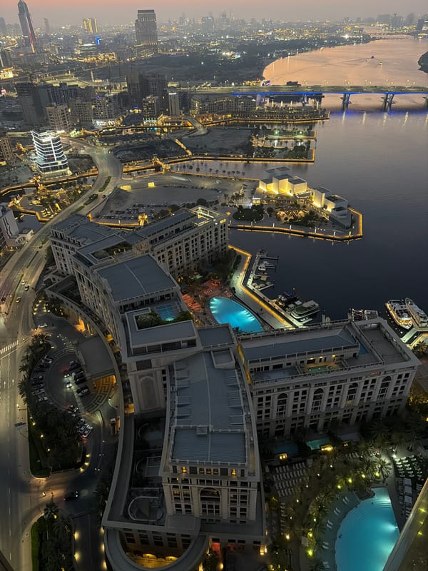 Dubai skyline from dusk to night, seen from above