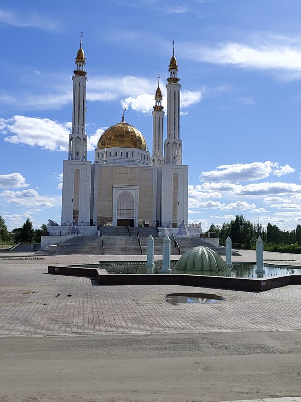Summer morning in Aktobe: mosques, snacks, and city streets