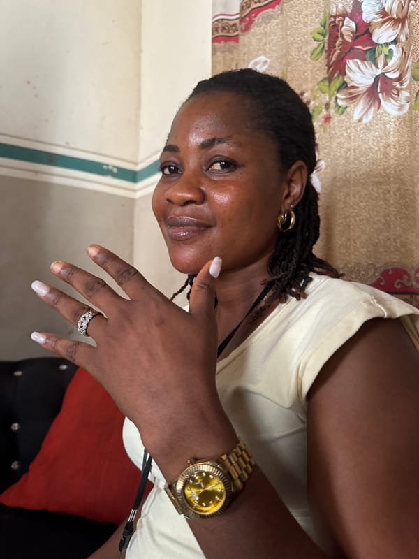 Woman enjoys meal in Badagry home wearing gold jewelry