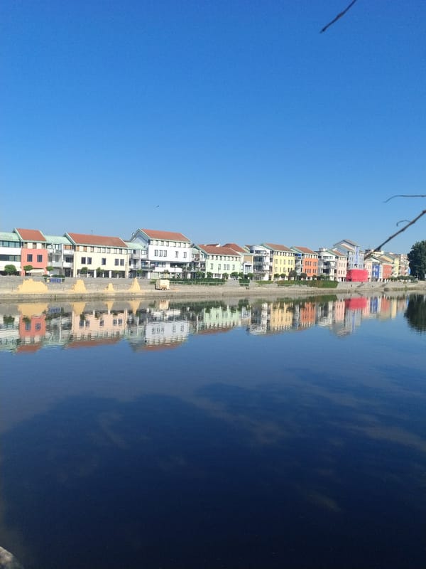 Summer morning along Písek's Otava River and Stone Bridge
