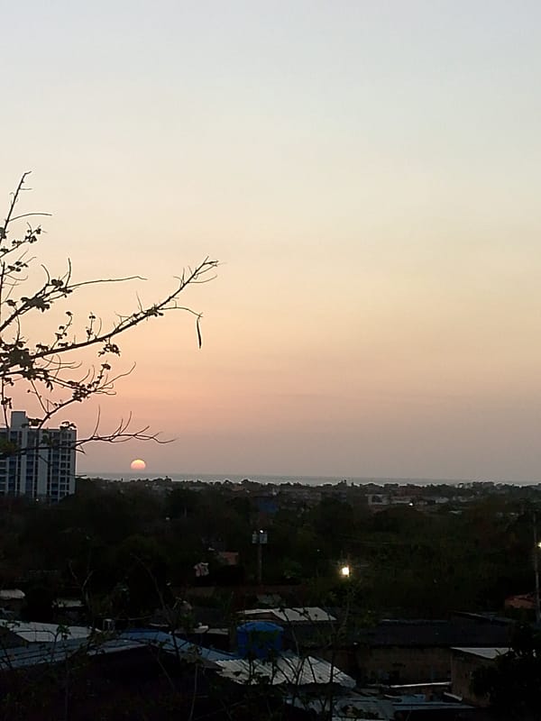 Sunset observed over Juan Griego, Venezuela residential area