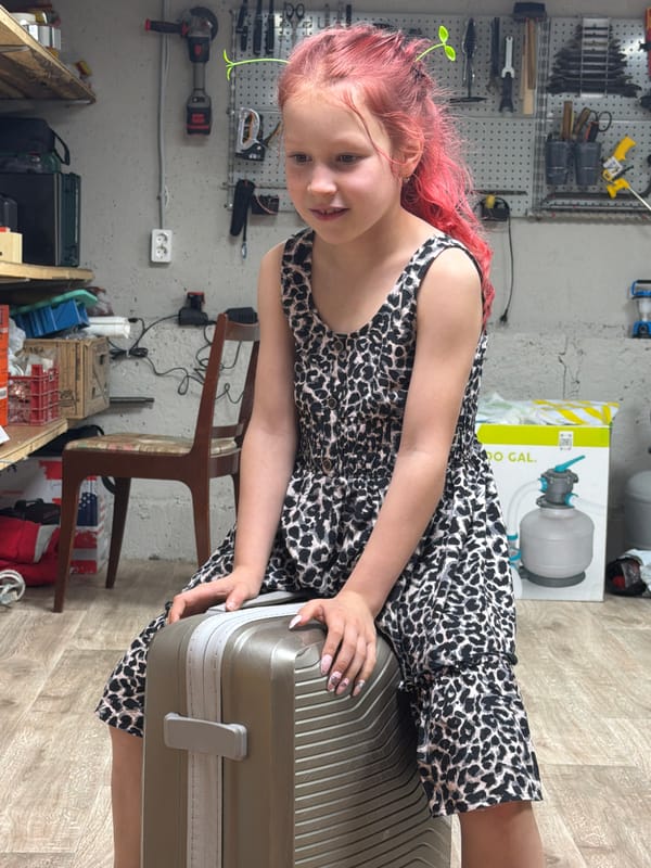 Child packs suitcase with pet rats in Russian garage