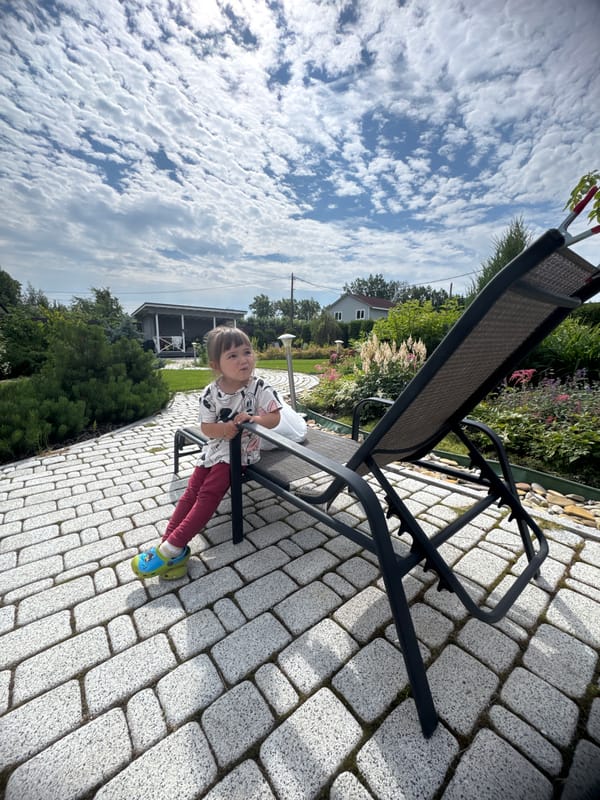 Sunny backyard scene at a tidy Oliki, Russia residence
