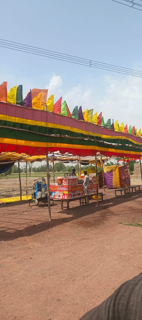 Outdoor refreshment stall documented in rural Mandihar, Pakistan