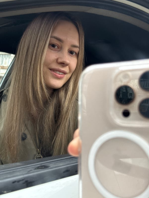 Woman photographs herself near Russian Railways train in Chaikovsky