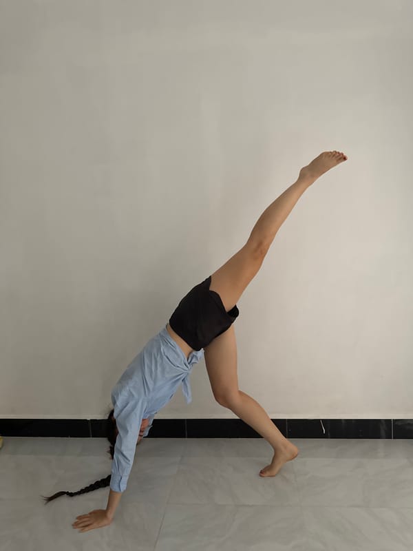 Person captured in dynamic inverted pose in Mũi Né