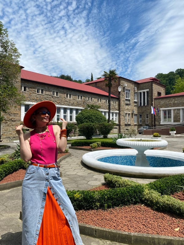 Tourist in pink and orange explores Sochi landmarks
