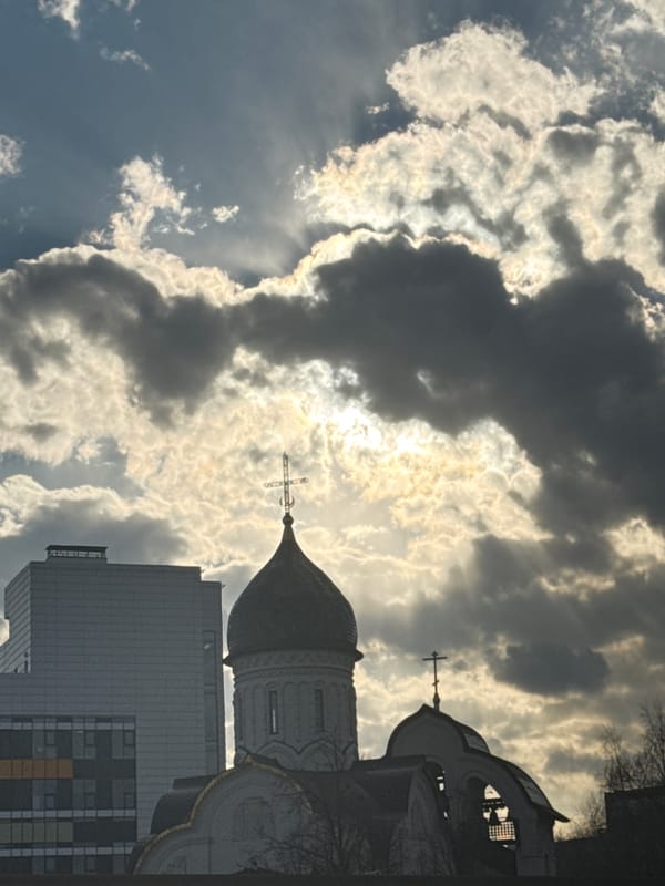 Orthodox church photographed against dramatic Moscow sky