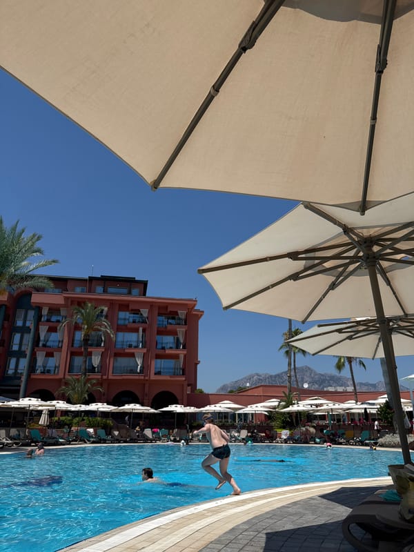Busy resort poolside in Kemer on a sunny morning