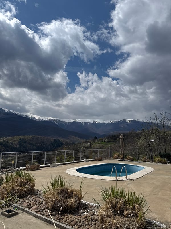 Private pool documented against mountain backdrop in Berkovitsa, Bulgaria