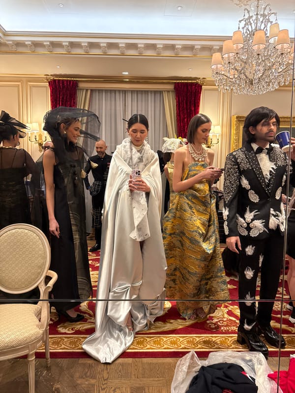 Formal fashion event preparations captured at luxury Parisian venue