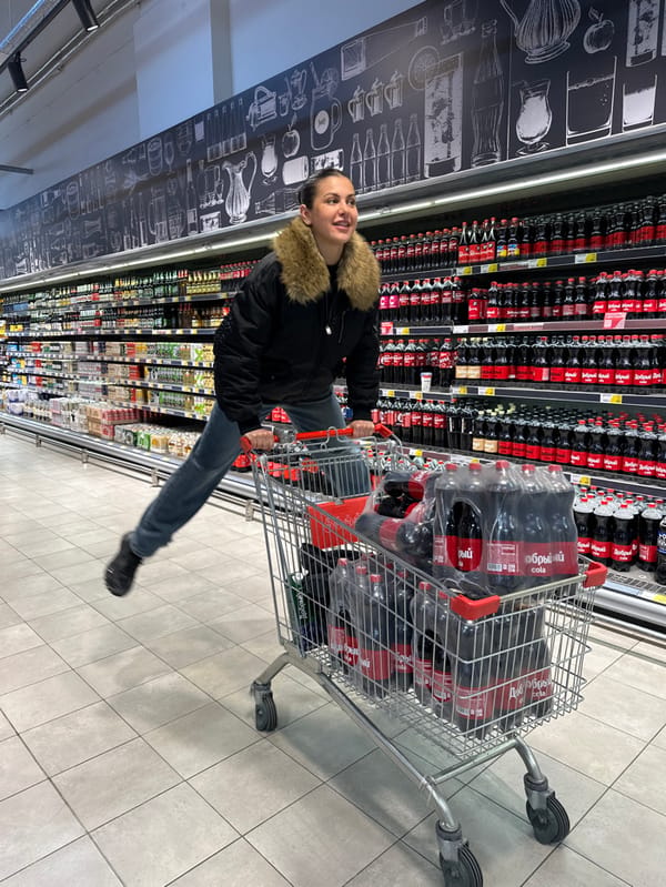 Shoppers browse supermarket aisles in Sochi during afternoon outing