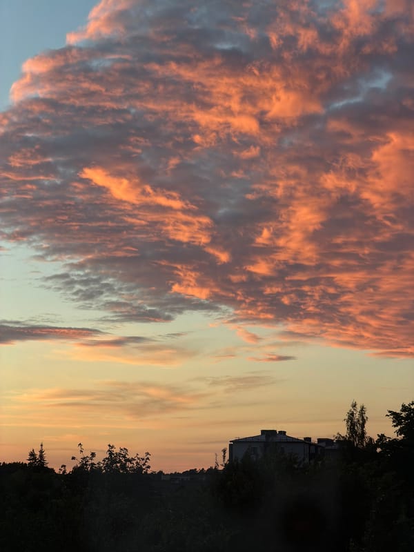Colorful summer sunset skies over Dreiliņi, Latvia
