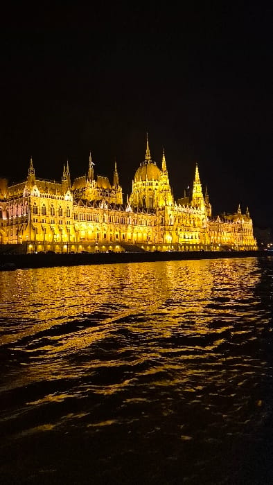 Hungarian Parliament Building illuminated golden at night, Budapest