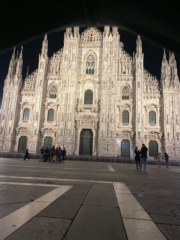 Nighttime gathering at Milan's Duomo cathedral captured by witness